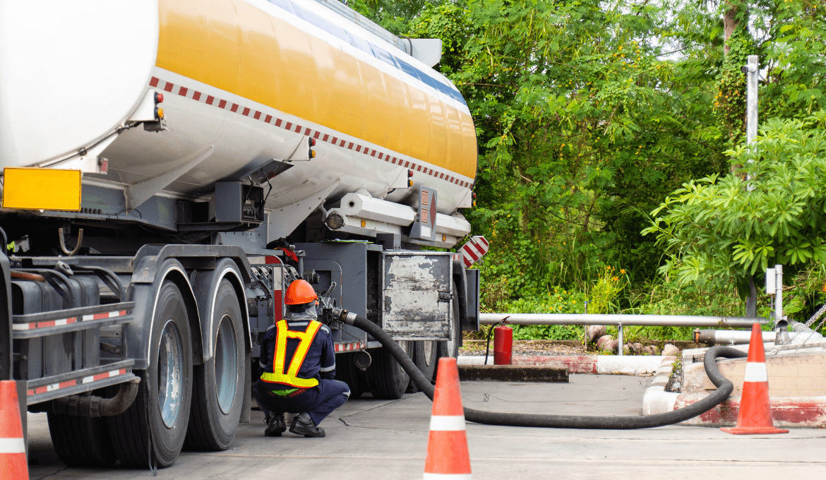 Fuel delivery-min Customer at fueling station gas pump
